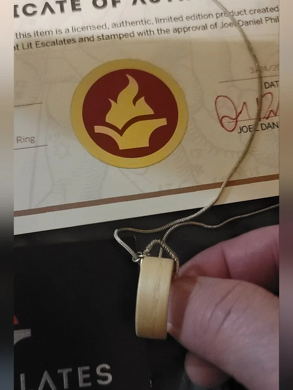 Lit Escalates Addie LaRue Wooden Ring Necklace
